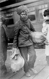 Sikh With Two Bags